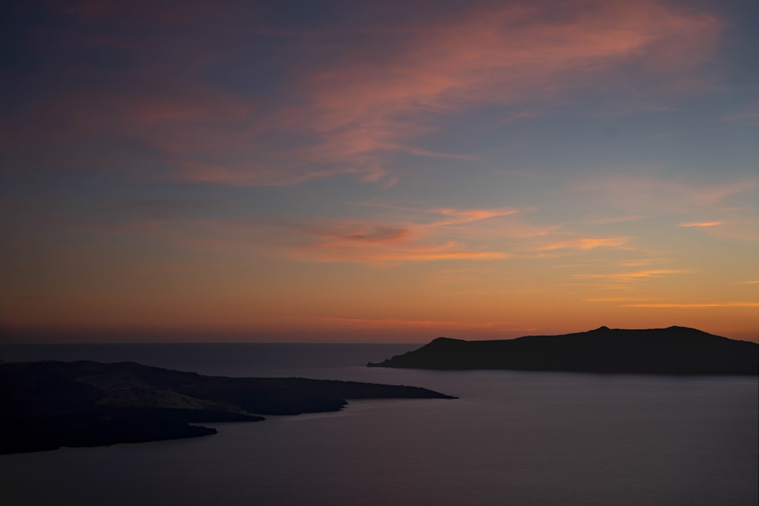 Greek coastline traditional hotel building sunset