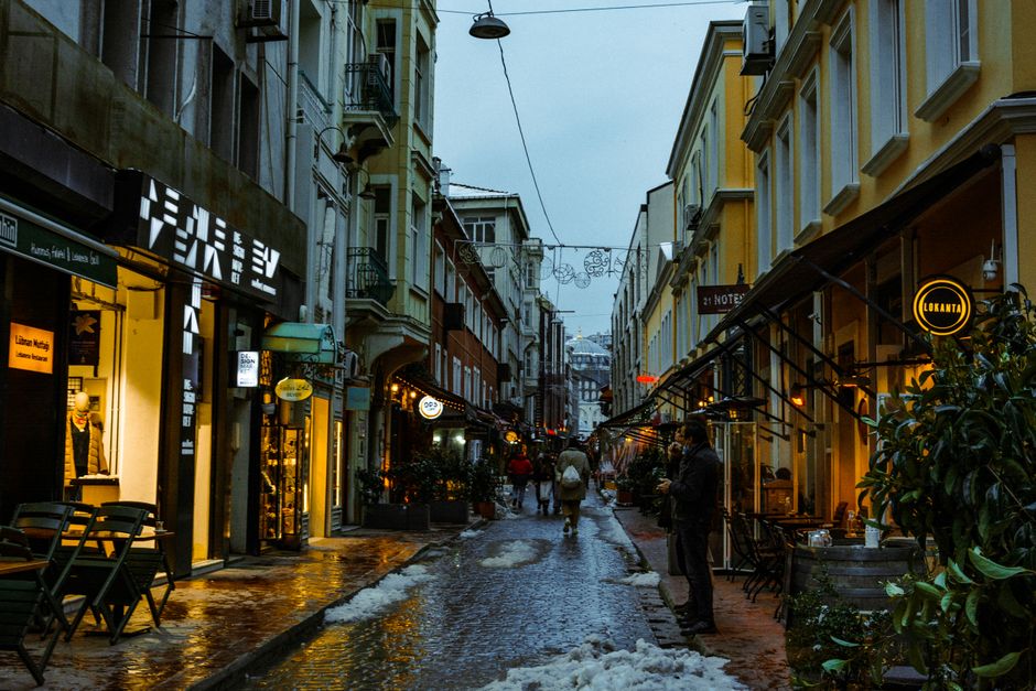 Tsar Osvoboditel Street Plovdiv evening lights cafes pedestrians