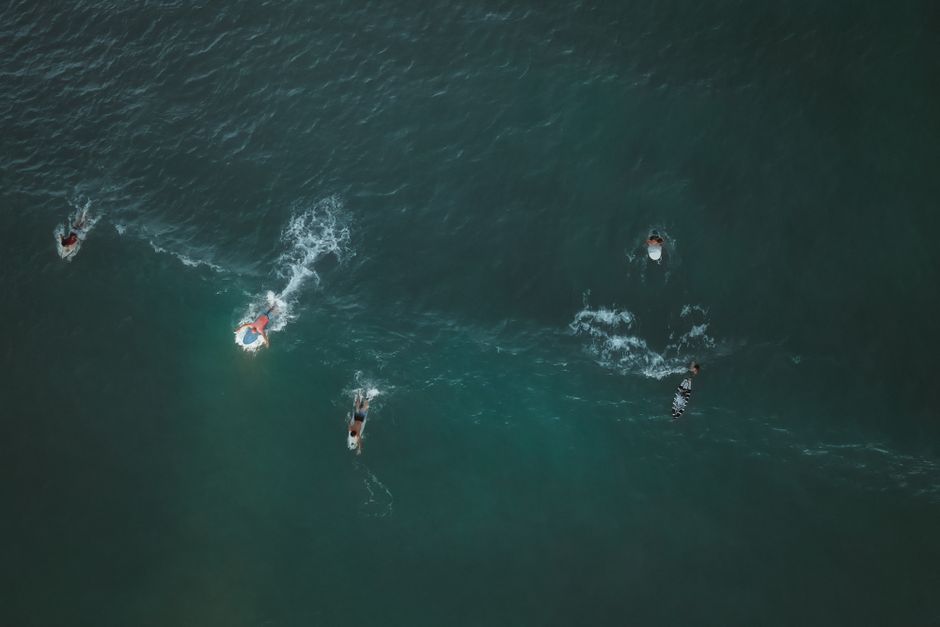 Albena Beach Bulgaria surfers paddling out grey waves
