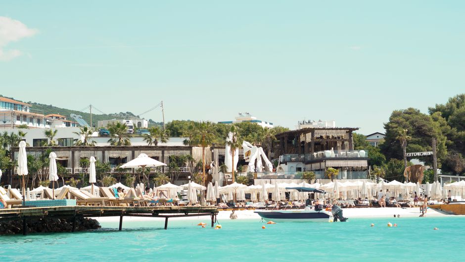 Albanian sandy beach Ksamil blue sea golden sand