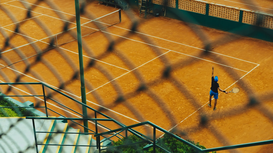 Grigor Dimitrov tennis serve action shot clay court