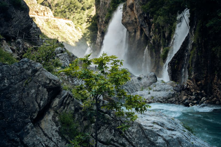 Grunas Waterfall Albania forest path waterfall spray