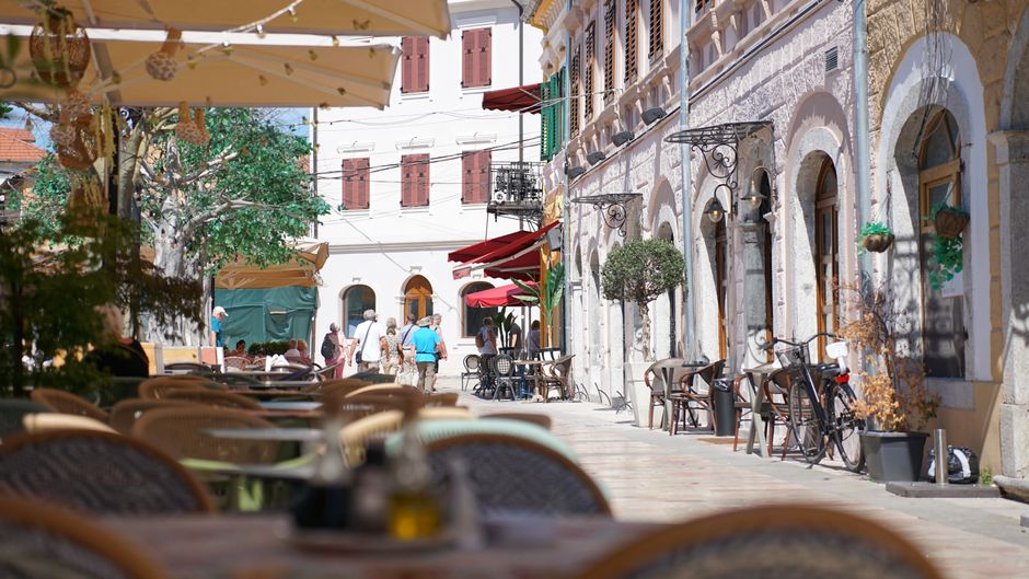 Gundulić Square Šibenik outdoor cafes stone buildings lively atmosphere