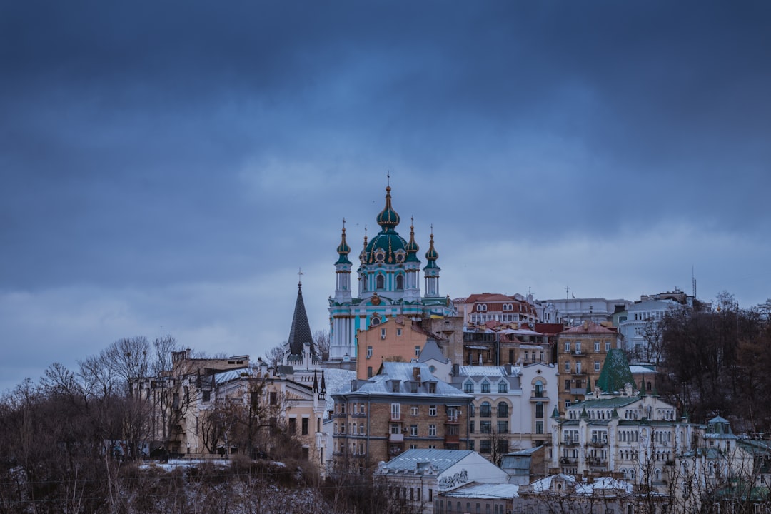 Kyiv city skyline under cloudy sky