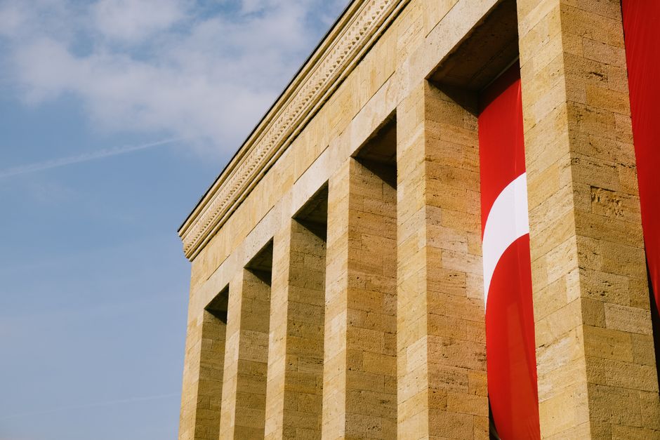 Turkish flag waving outside government building Ankara