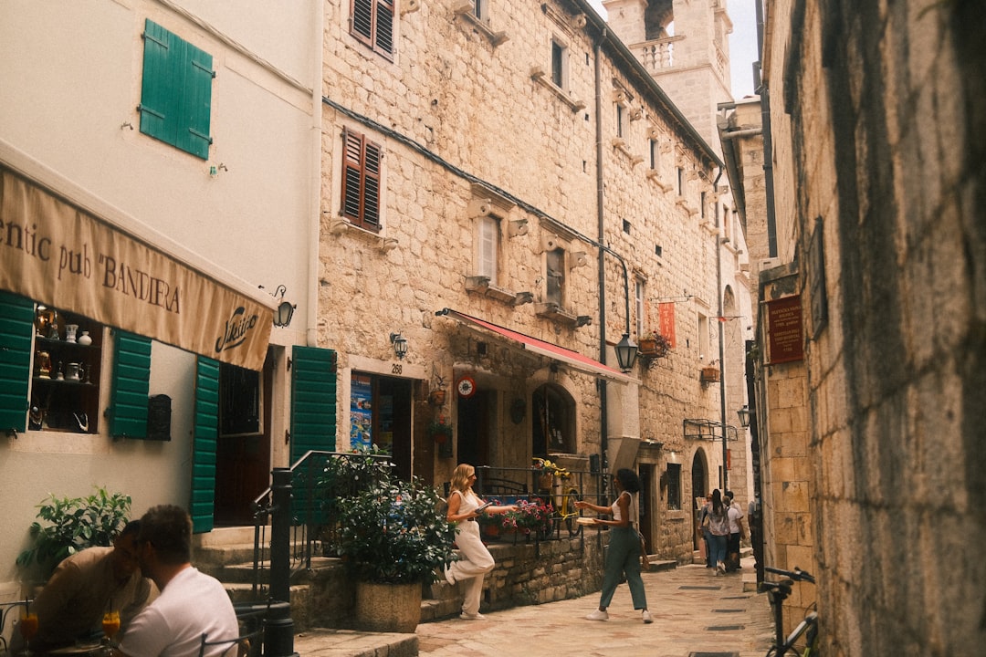 Kotor Old Town Square bars crowded evening lights