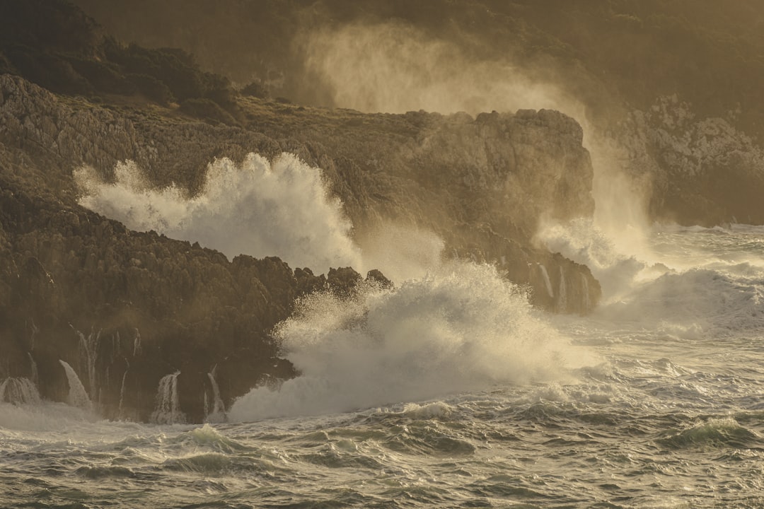 Greek coast storm waves rocky shore