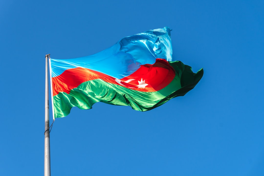 Serbian flag waving against blue sky