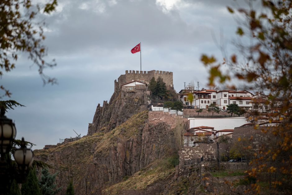 Turkish flag waving over Ankara cityscape