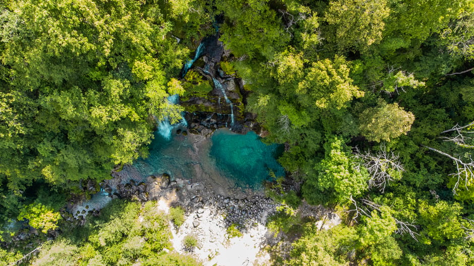 Crkvice Waterfall Bosnia clear pool surrounded by green forest