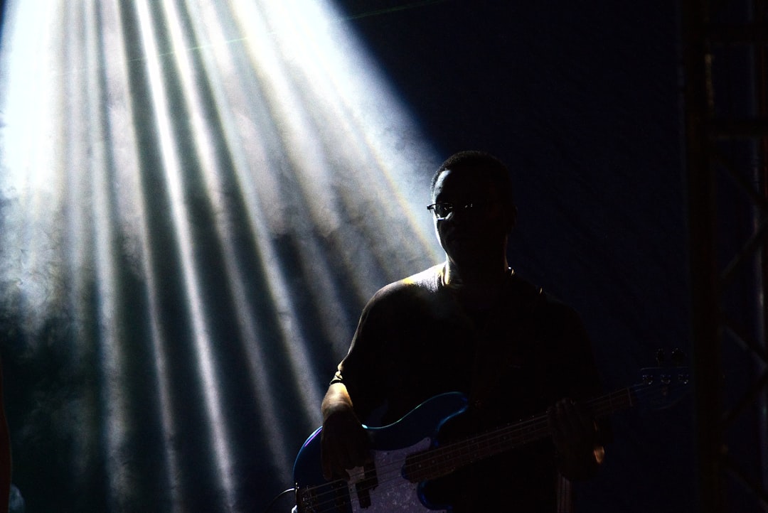 Lenny Kravitz guitar solo close up stage lights
