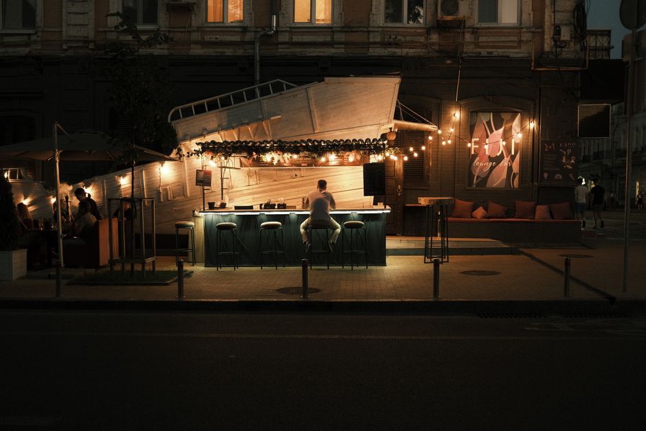 Mostar nightlife street scene cafes bars evening lights