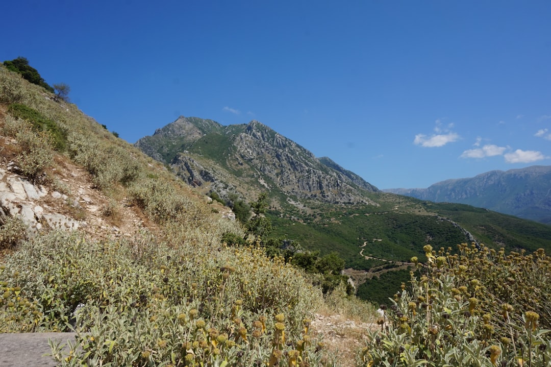 Theth Pass Albania panoramic view hikers saddle mountain landscape