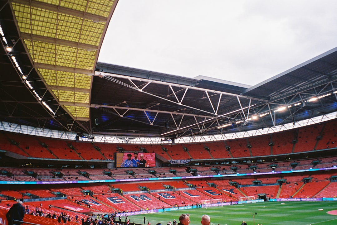 VAR referee reviewing screen football stadium