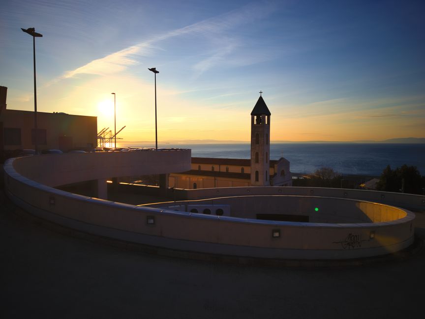 Strunjan Lighthouse white tower cliff Adriatic Sea sunset
