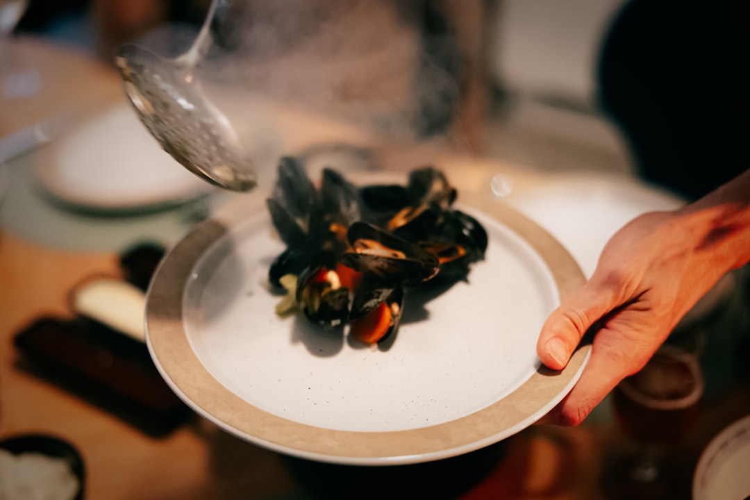 Montenegrin black risotto seafood plate restaurant table