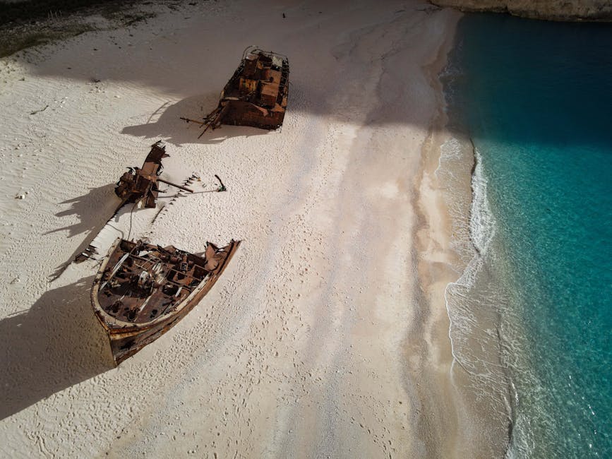 Zakynthos Shipwreck Beach rusty hull turquoise water cliff view
