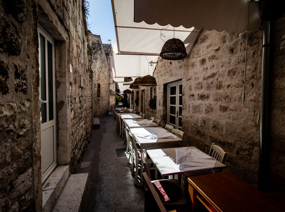 Gjirokastër Old Town restaurant terrace outdoor dining stone buildings