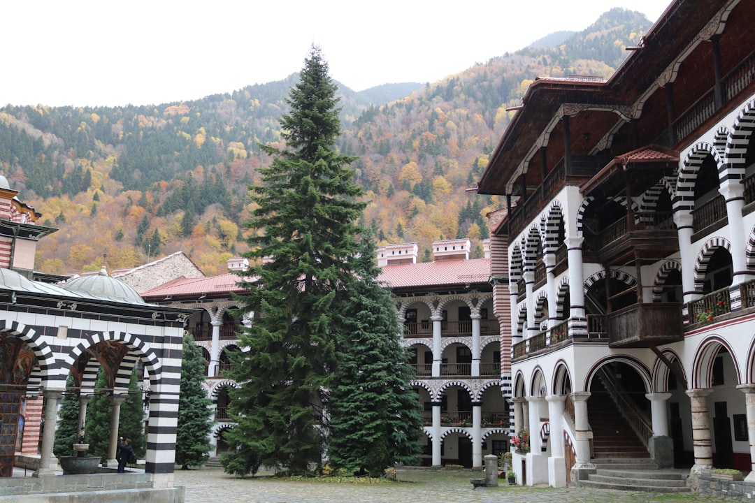 Rila Monastery garden flowers monks tending plants