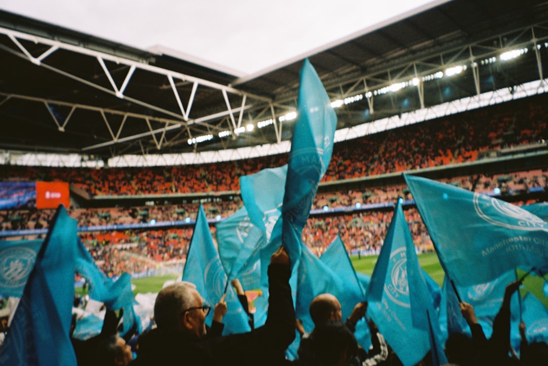 Balkan football fans waving flags stadium atmosphere