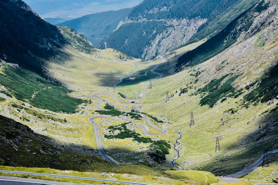 Moldavia Romania mountain road winding car driving painted churches