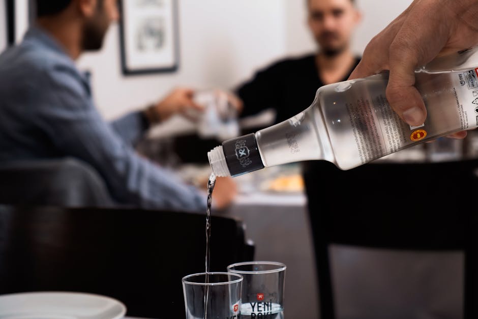Bar Raki Litochoro Greece ouzo bottles night