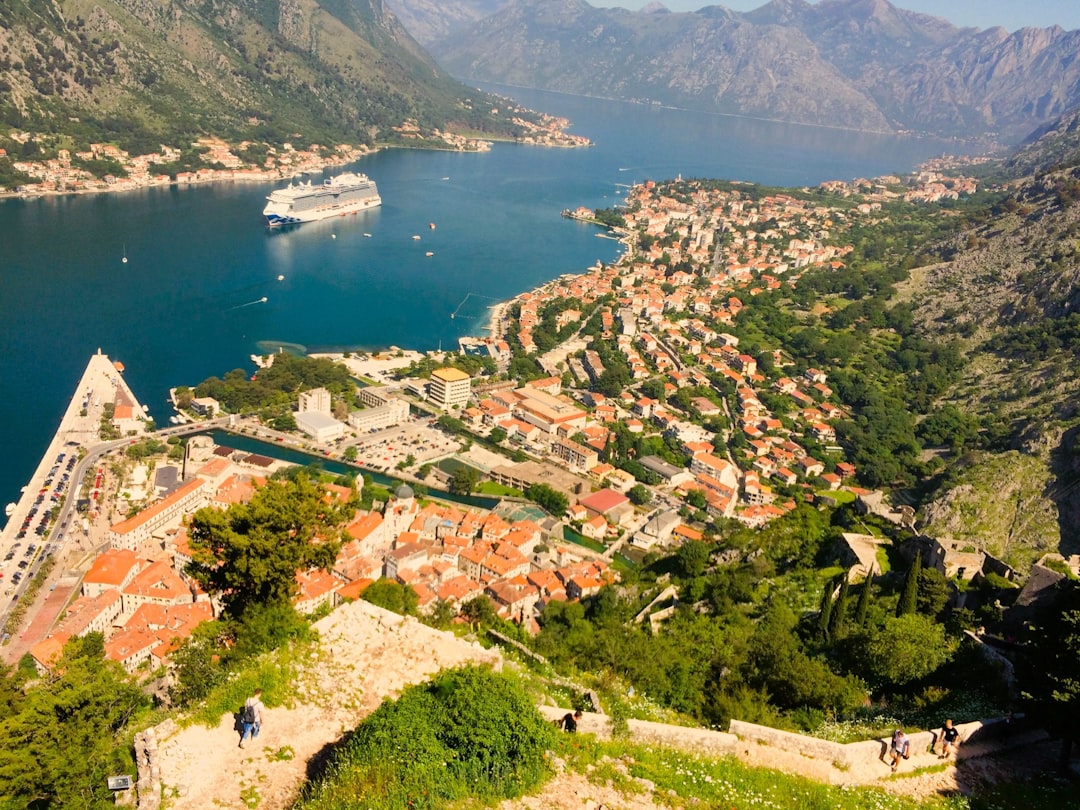 Fortress of San Giovanni Kotor view over bay shipyard sunset