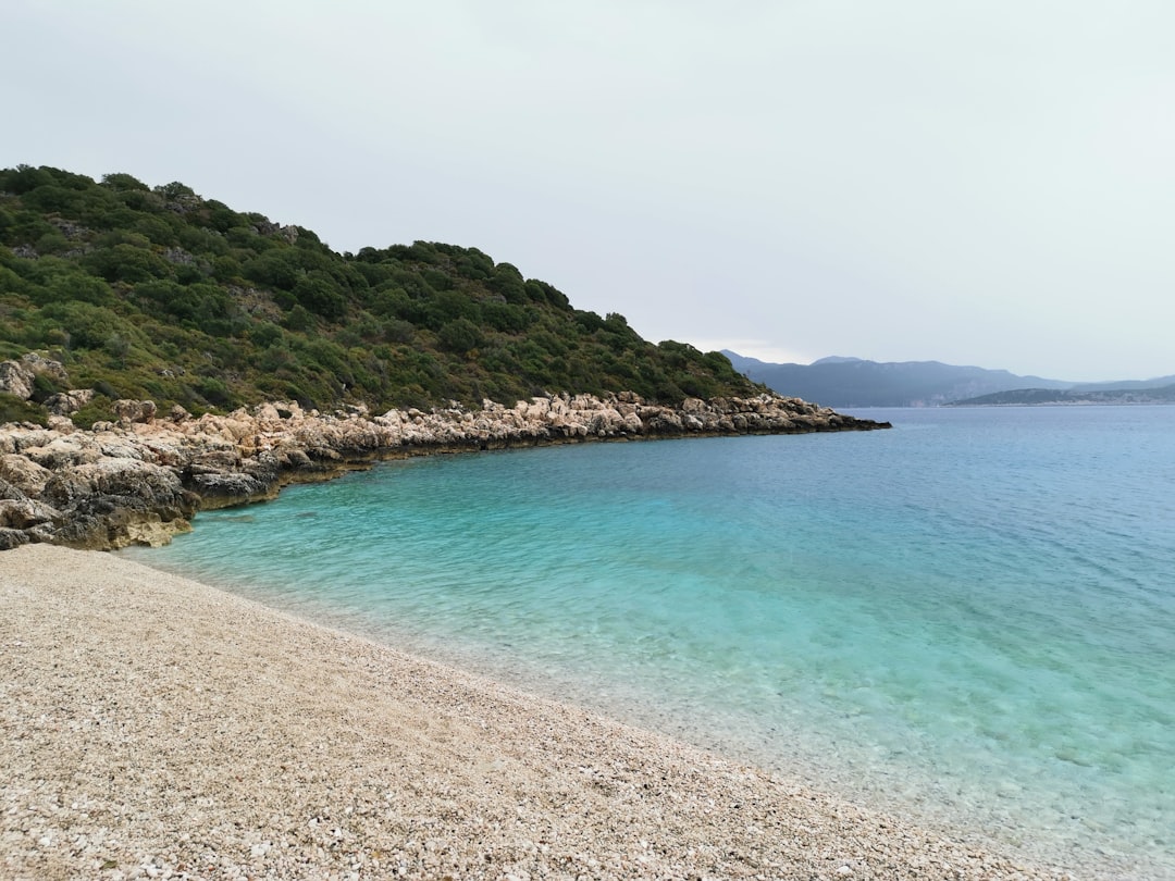 Kršan Beach Rovinj pebble beach clear blue water