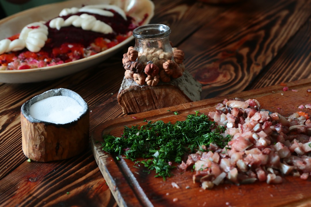 Serbian traditional food cevapi shopka salata rakija wooden table