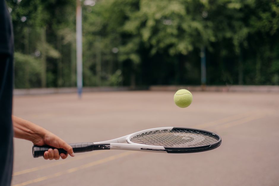 Jannik Sinner serving tennis ball close up