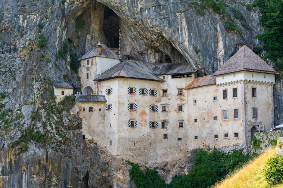 Postojna village Slovenia exterior entrance cave parking lot tourists day