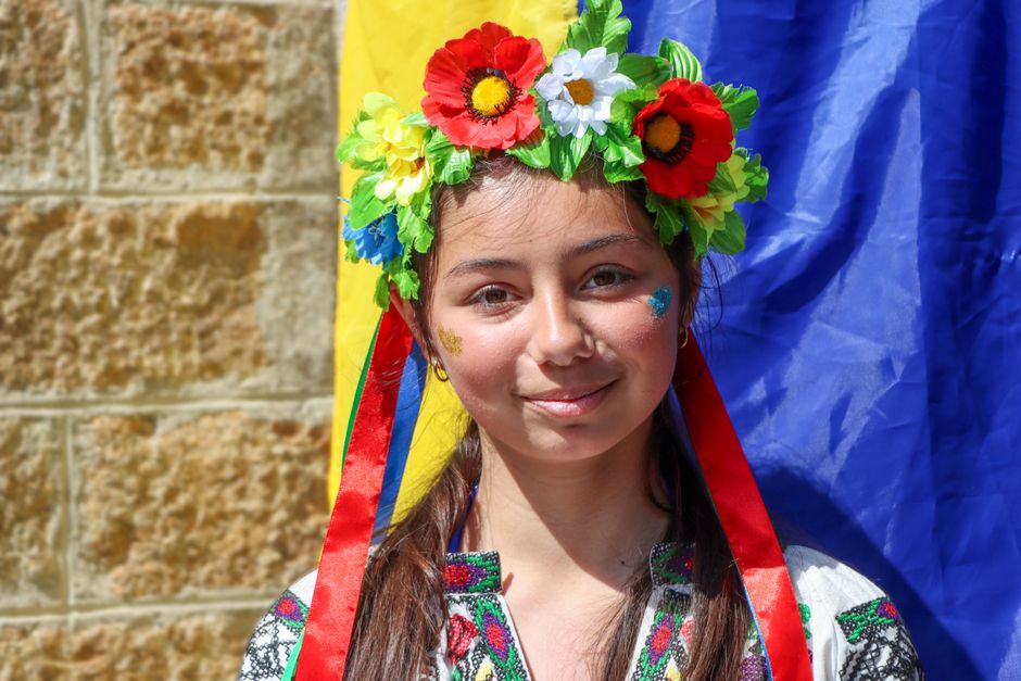 Romanian women weaving flower wreaths Dragaica festival