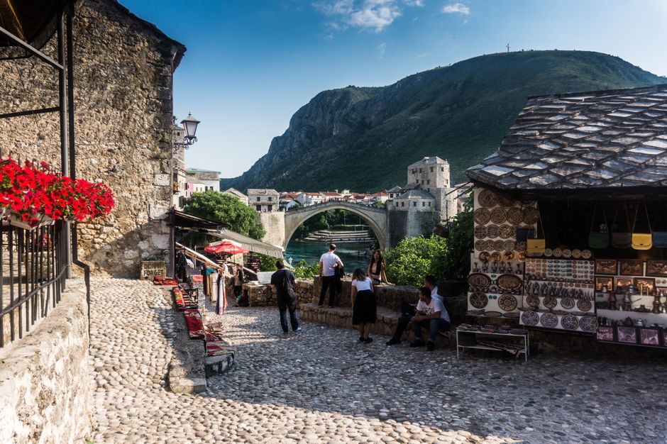 Old Bazaar Mostar Bosnia Herzegovina narrow street cafes people
