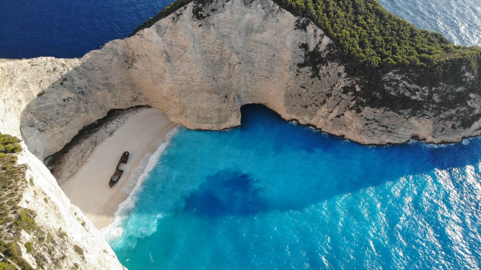 Navagio Beach Shipwreck Bulgaria clear water cliffs drone view