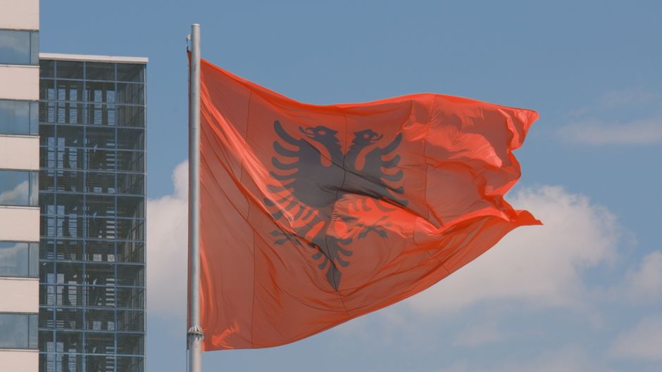 Albanian flag waving in Tirana square