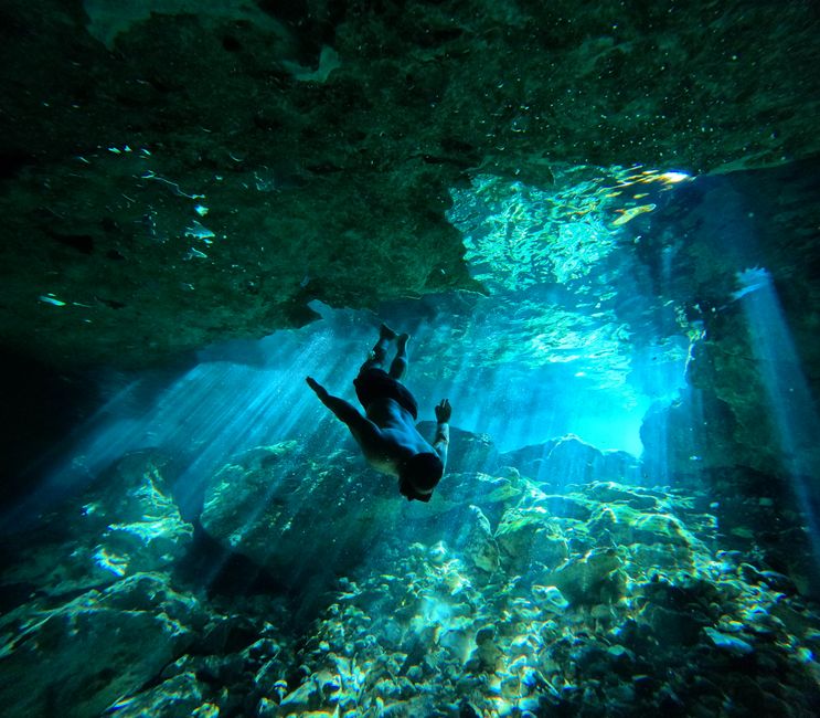Volcanic sea cave Limnos Greece light beams underwater