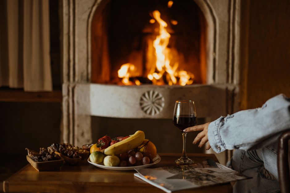 Rustic guesthouse common room fireplace local drinks Bosnia