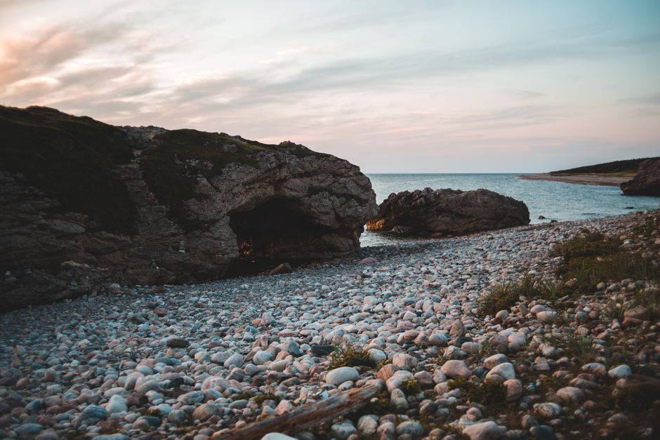 Agios Minas Beach Chios pebbles cliffs caves rugged