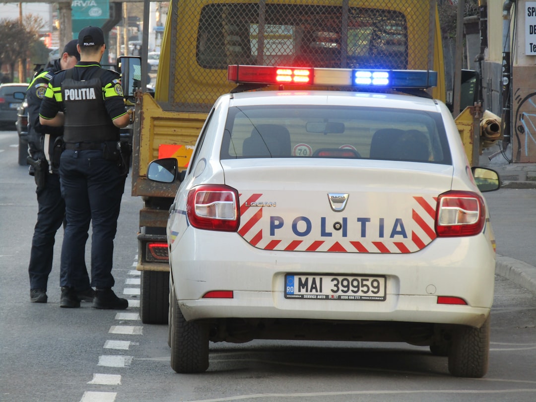 Romanian flag and police vehicle night raid