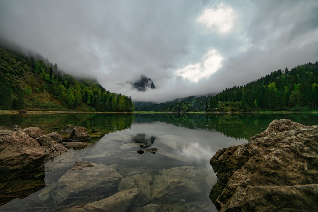 Crno Jezero Black Lake Montenegro reflection granite peaks mist morning
