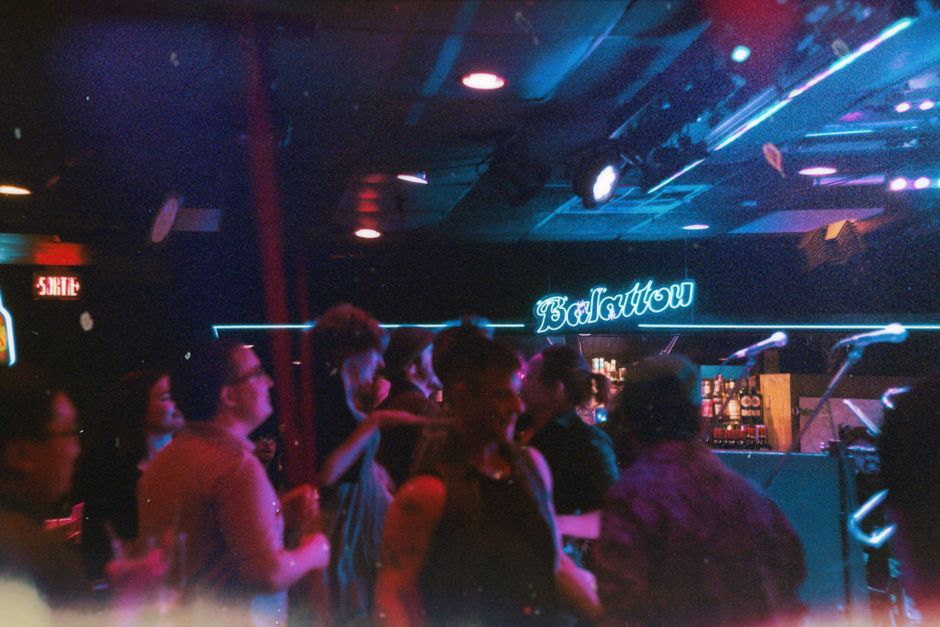 Kapana district Plovdiv Bulgaria night club neon lights people dancing