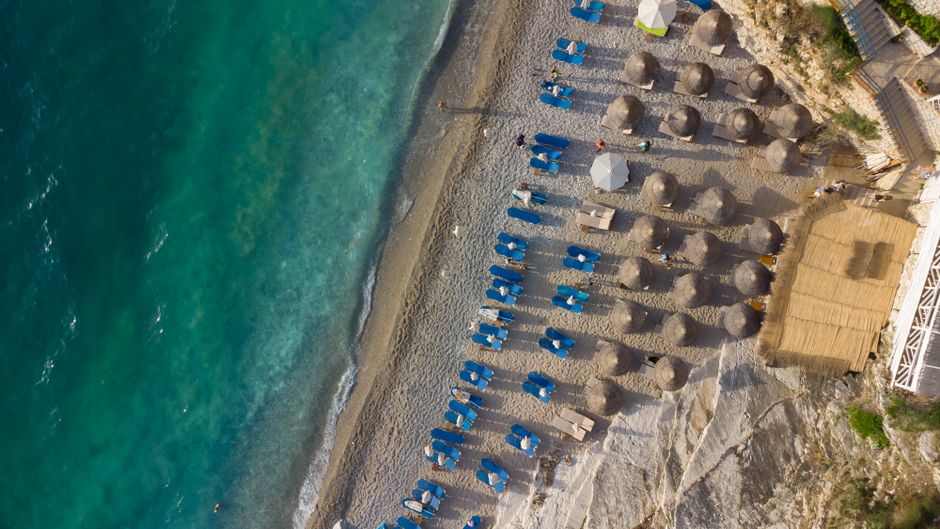 Plava Voda beach Ulcinj clear blue water sunbeds small restaurant