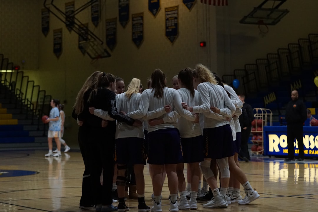 Belgian women's volleyball team huddle during timeout