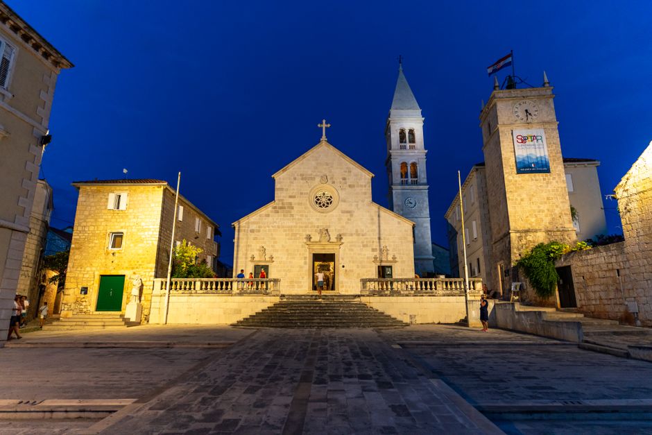 Rab Old Town Croatia narrow stone alley Gothic cathedral bell tower morning light