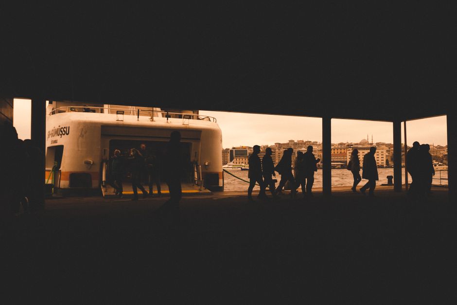 Piraeus port Greece ferry terminal sunset tourists walking