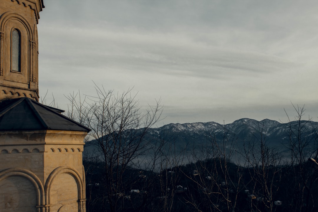 Rila Monastery Clock Tower exterior stone facade mountain background