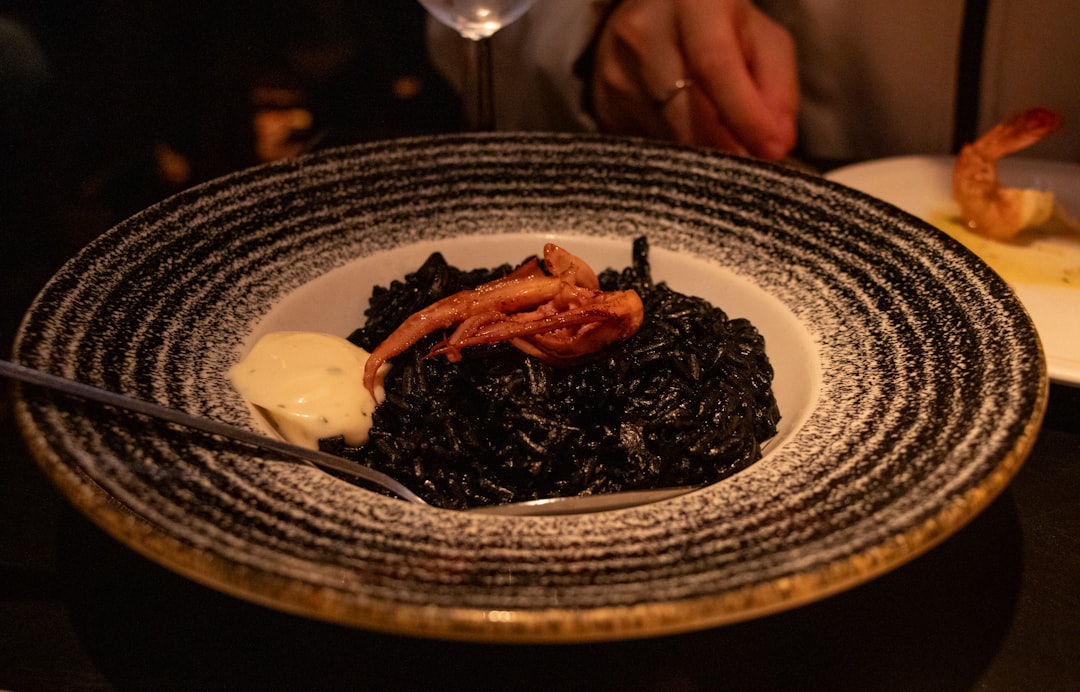 Close up of black risotto with squid ink Croatian restaurant