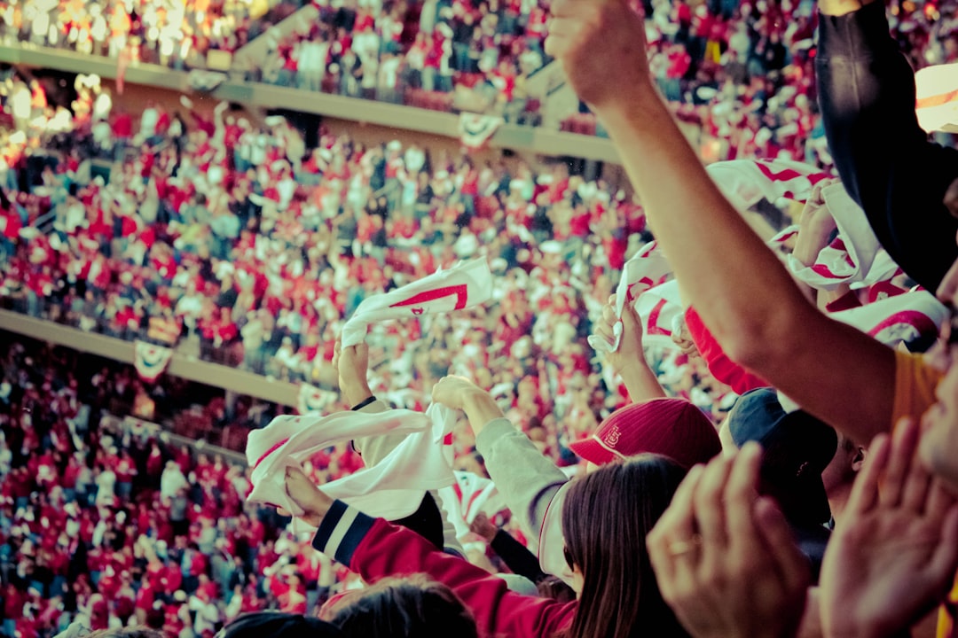 Stadium crowd cheering women's football match