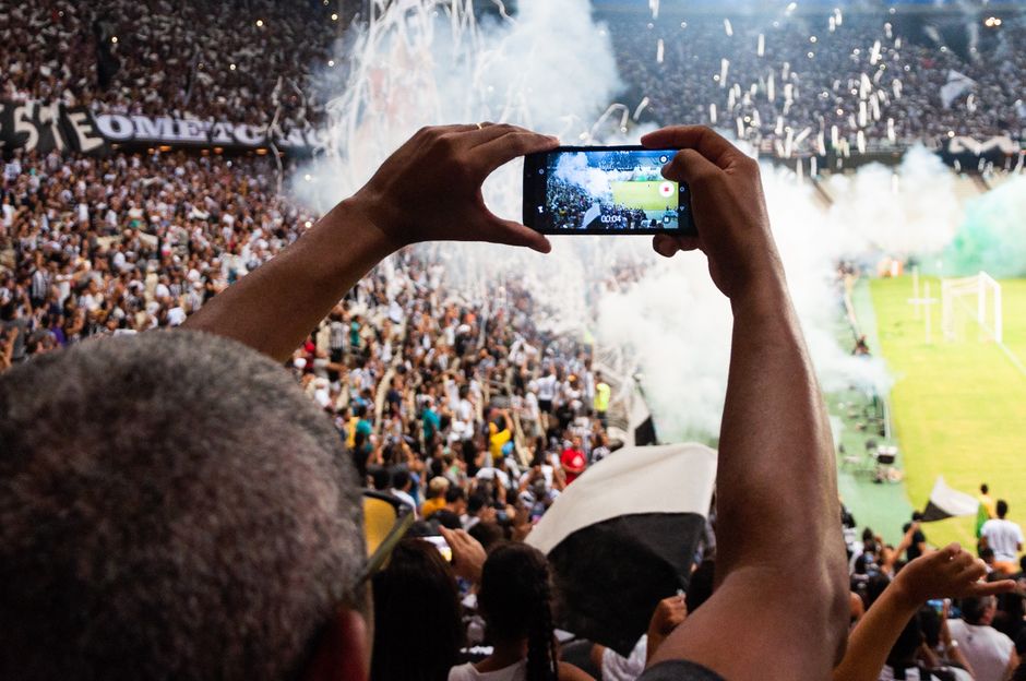 Middle East football fans watching match smartphone