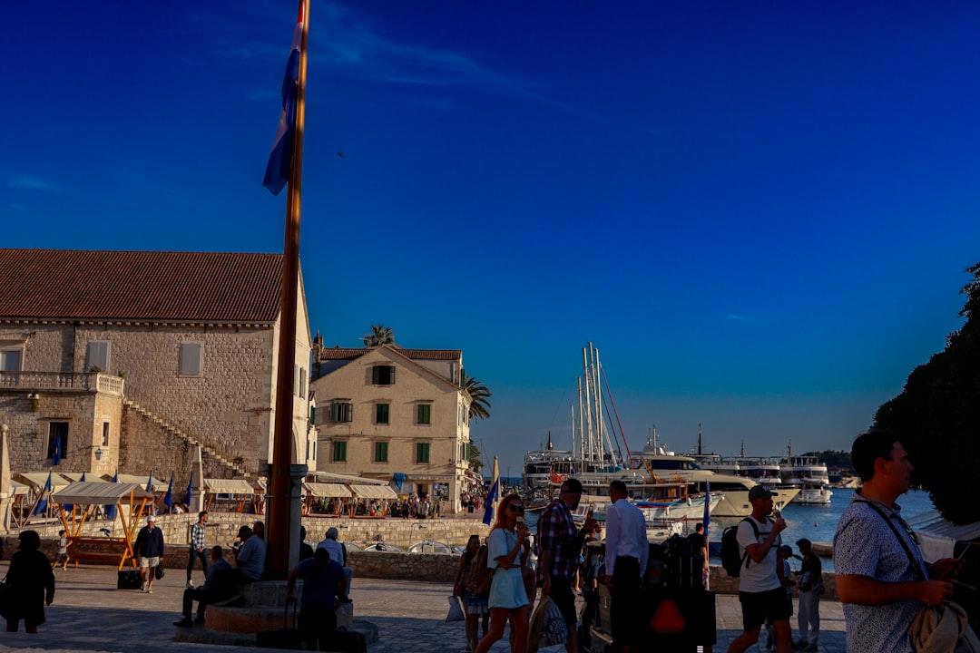 Komiža harbor taverns Croatia evening atmosphere outdoor seating